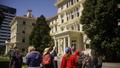 A group of walk tour participants gathering outside Old Government Buildings, as part of the ‘A Change is Coming’ walk tour in 2025.