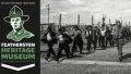 "Featherston Heritage Museum", prisoners and army personnel walking near a wire fence