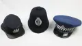Three Police hats, ranging from different eras of history