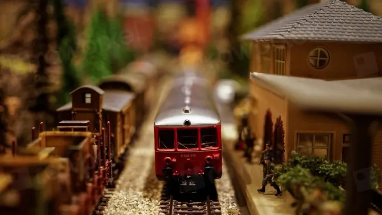 Photo of a miniature red train.