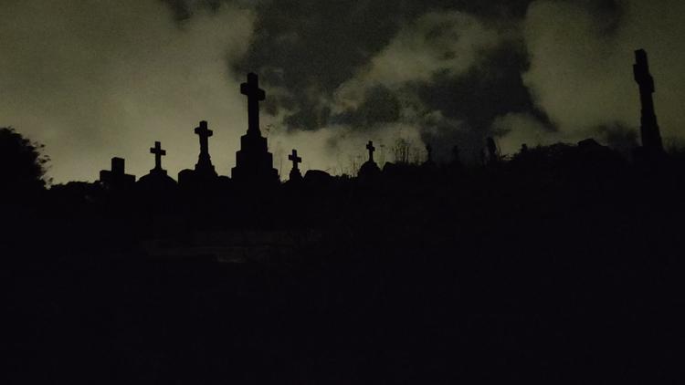 Night photo of graves in Karori Cemetery