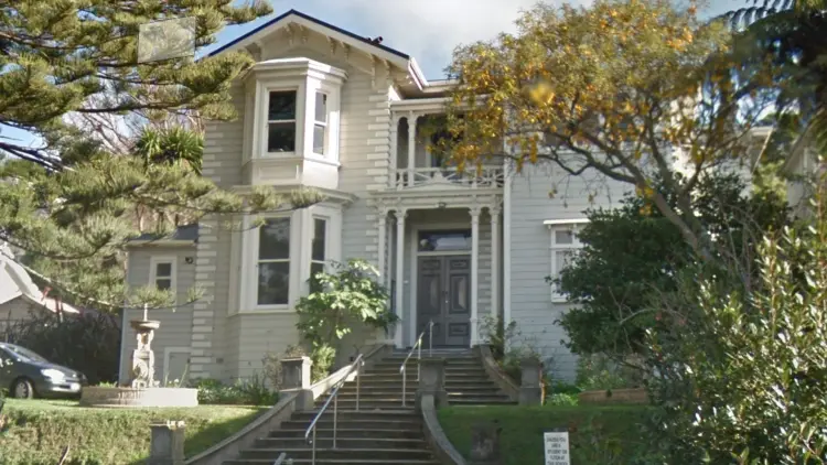 Colonial style house and trees