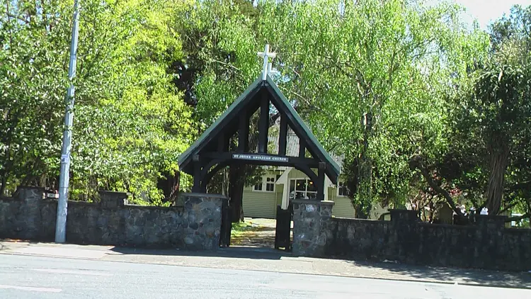 Church surrounded by green trees