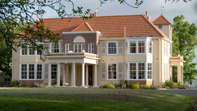 Exterior shot of grand historic homestead