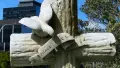 Headstone cross with stone dove