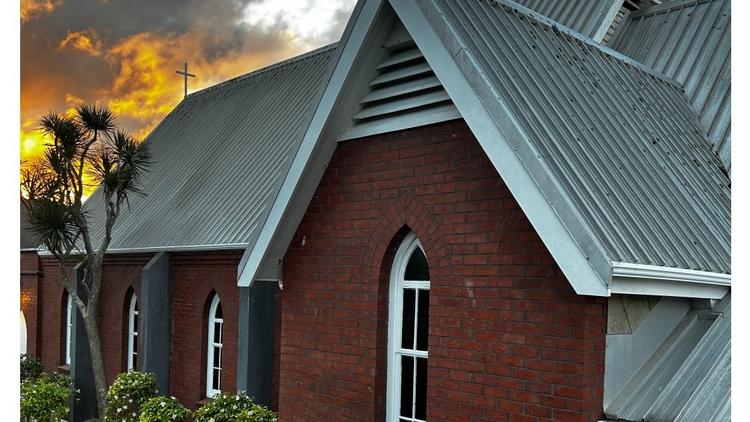 Dramatic skies above St Luke's the church on the hill in Wadestown