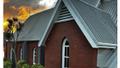 Dramatic skies above St Luke's the church on the hill in Wadestown