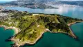 Green land surrounded by ocean