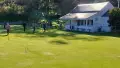 Green lawn and a white house