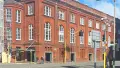 Large brick building in a city