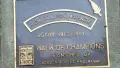 Black and gold headstone for Walk of Champions, silver fern icon on top right