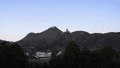 Hills in front of a light blue sky