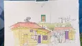 Sketch of a yellow cottage on paper