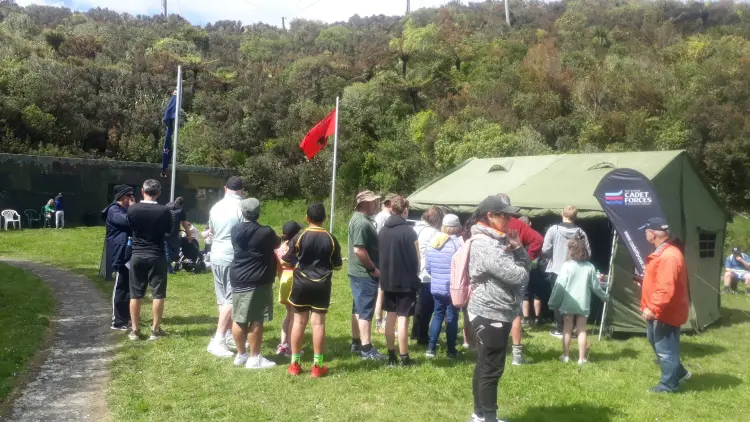 People standing outside a tent