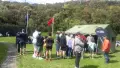 People standing outside a tent
