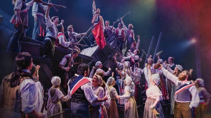 Musical performance on a stage with many people