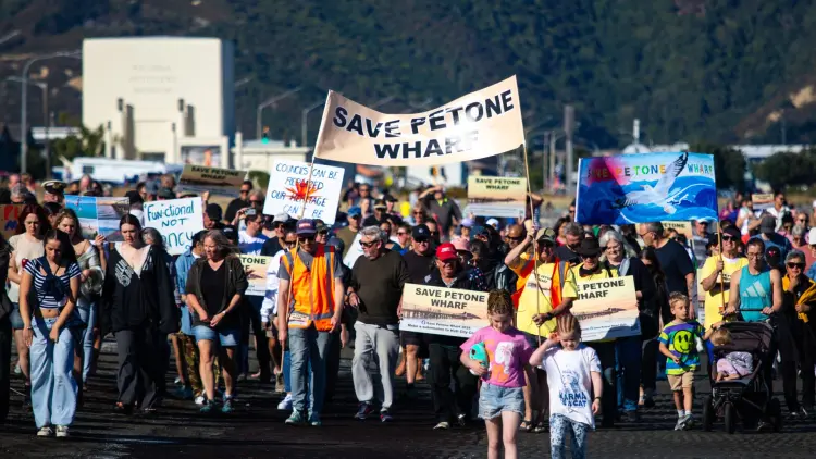 People holding colourful protest signs