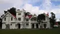 Exterior shot of grand historic homestead