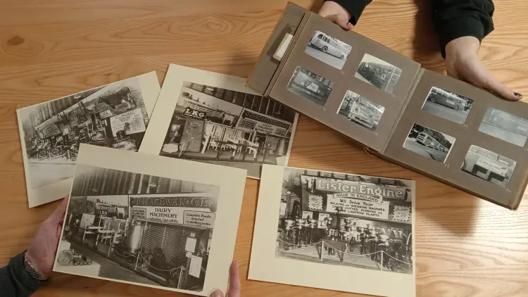 Historic archive photos on a table and in a book