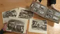 Historic archive photos on a table and in a book