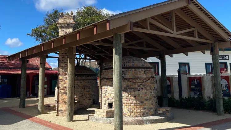 Brick kiln under a wooden structure in the sunlight