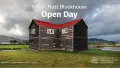 Photo of a wooden blockhouse building with a red roof in a green field with white text above. A Heritage NZ logo is on the bottom right.