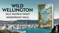 Text: Wild Wellington Ngā Taonga Taiao waterfront walk. Book on the right, Wellington harbour in the background