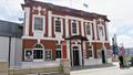 Exterior of red and white Circa theatre building
