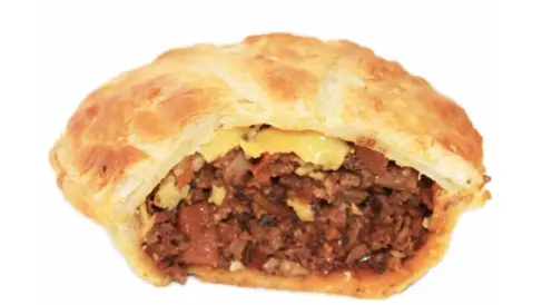 Half of a mince and cheese meat pie.