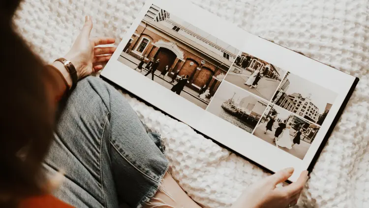 A person holding a photograph collage