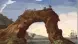 Image of an arch of rock with a sailing ship nearby.