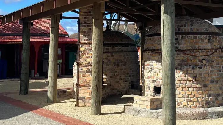 Photograph of the red and brown bricked beehive shaped kilns at Te Horo