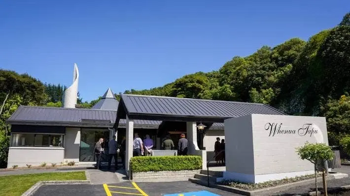 Grey building and sign for Whenua Tapu