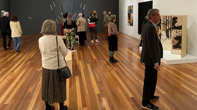 People standing in an art gallery