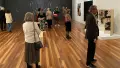People standing in an art gallery
