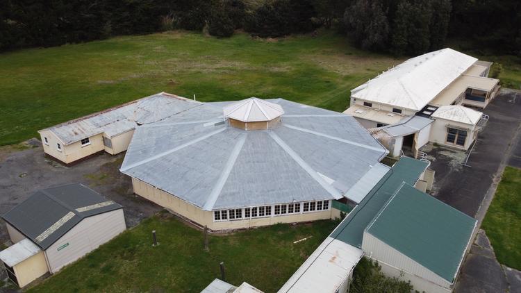 Aerial view of an octagonal large Rotunda building, surrounded by other buildings