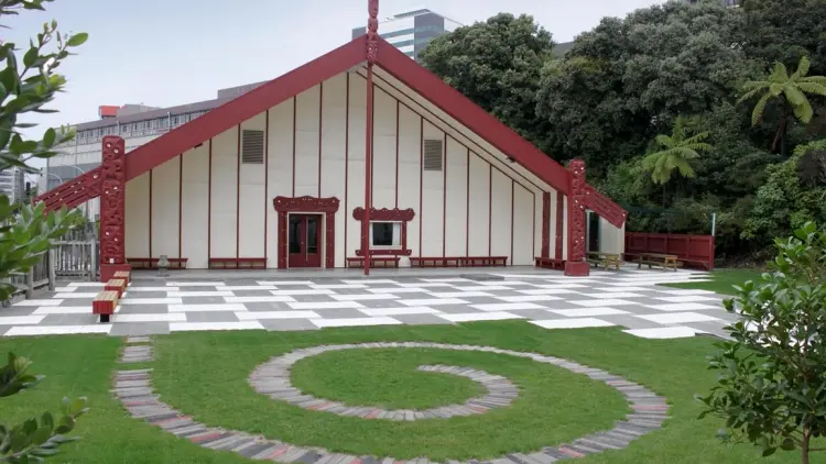 A marae in front of a green lawn