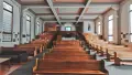 Interior shot of church with pews and high roof