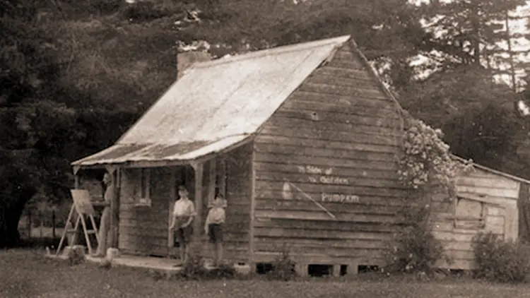 Exterior shot of old cottage.