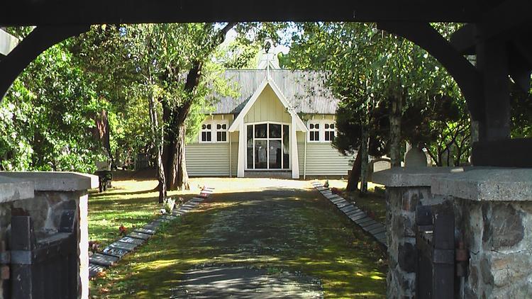 Exterior of St John's Church, Trentham. Viewed from outside of the church yard's gate.