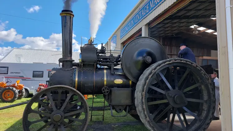 Photograph of a steam machinery with man